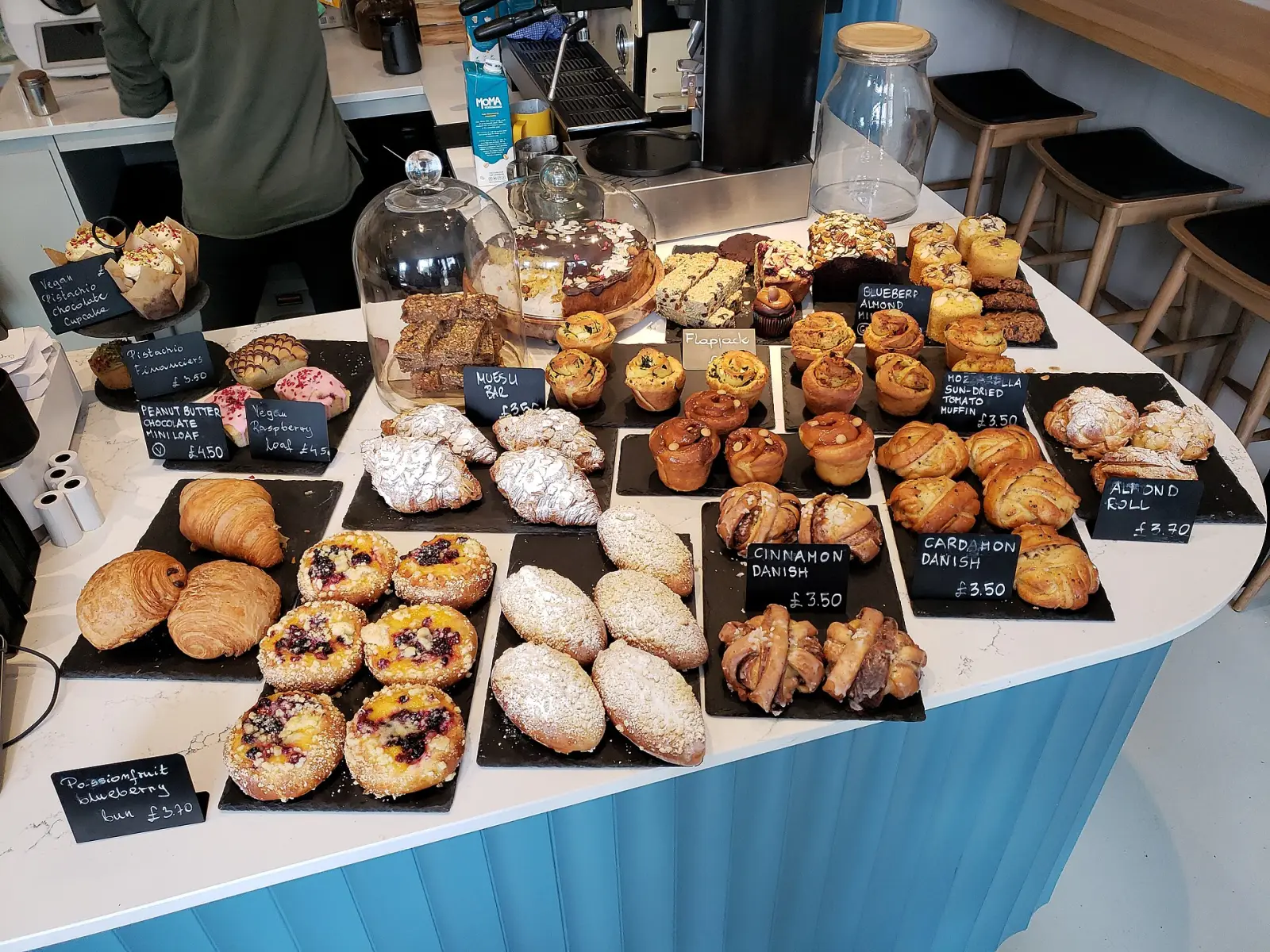 Breads and pastries on a bakery counter. The photo was not taken at a Milton bakery.