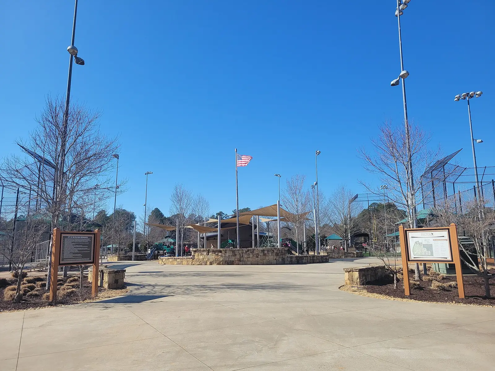 The entrance plaza and ballfield lights at Bell Memorial Park on Bell Park Drive in Milton